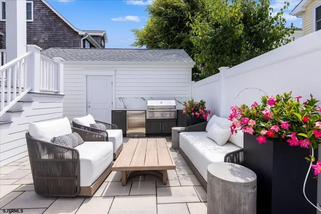 a bathroom with a painting on the wall and shower