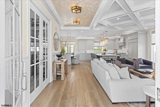 a living room with furniture a rug and a window