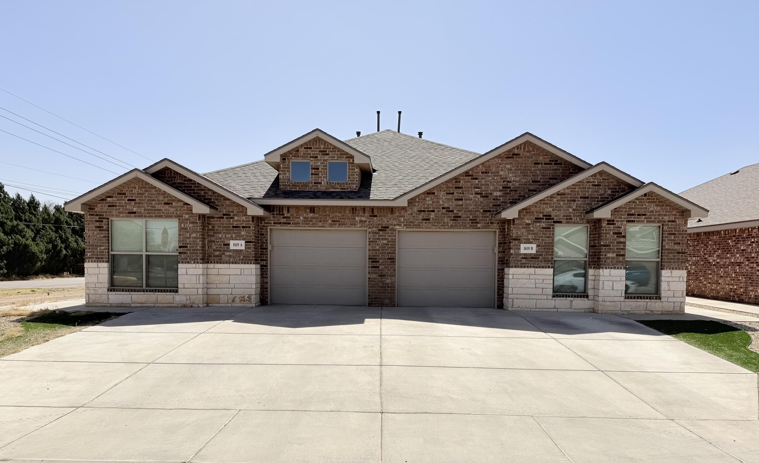 a front view of a house with a garage