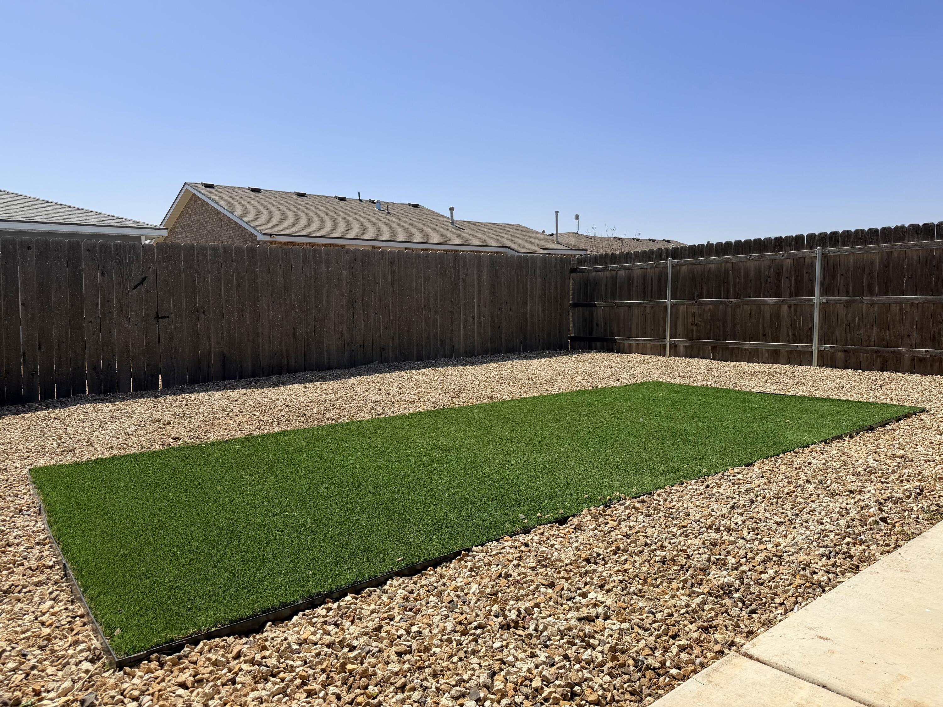 1619 133rd Street, Unit B Lubbock, TX 79423 - Photo 24 of 24 a view of a backyard with a garden
