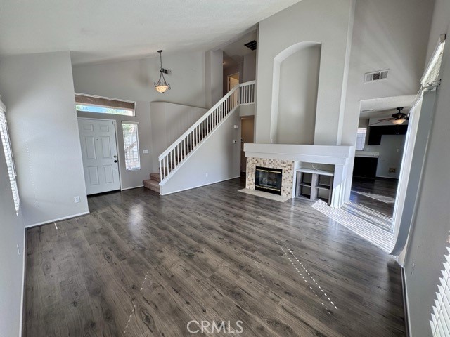 43370 Corte Benitez Temecula, CA 92592 - Photo 12 of 46 a view of a livingroom with wooden floor and stairs