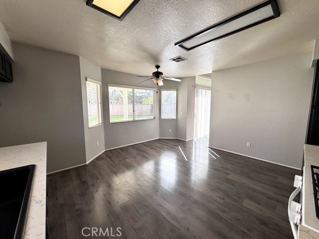 43370 Corte Benitez Temecula, CA 92592 - Photo 18 of 46 a view of an empty room with wooden floor and a window