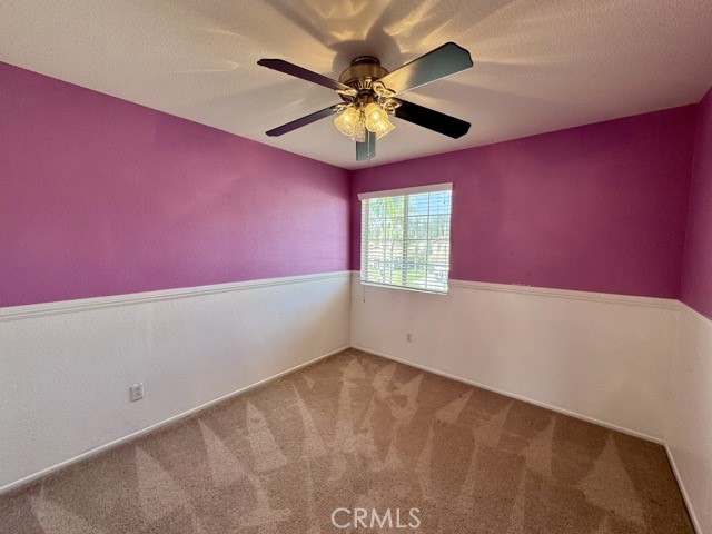 43370 Corte Benitez Temecula, CA 92592 - Photo 26 of 46 an empty room with a ceiling fan and a window