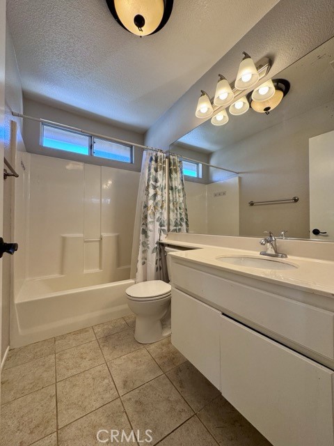 43370 Corte Benitez Temecula, CA 92592 - Photo 30 of 46 a bathroom with a toilet a sink a mirror and a shower