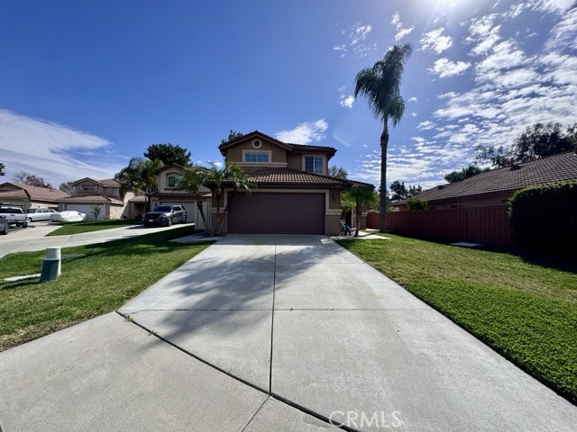 43370 Corte Benitez Temecula, CA 92592 - Photo 3 of 46 a front view of a house with a yard and garage