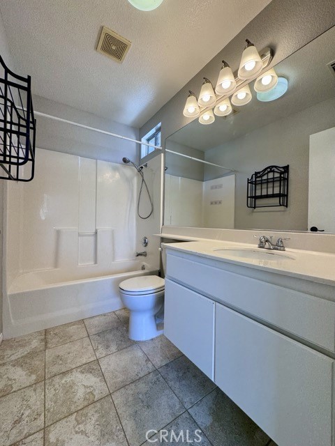 43370 Corte Benitez Temecula, CA 92592 - Photo 36 of 46 a bathroom with a sink a toilet and a mirror