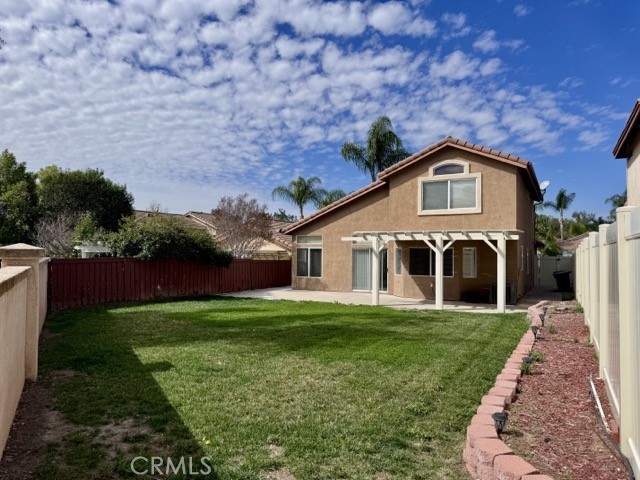 43370 Corte Benitez Temecula, CA 92592 - Photo 43 of 46 a front view of a house with yard and green space