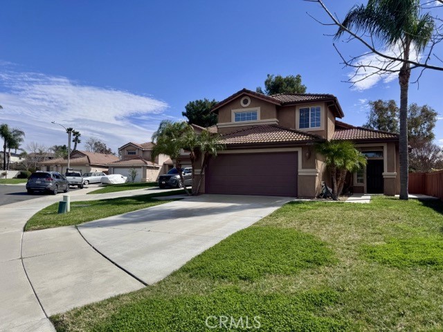 43370 Corte Benitez Temecula, CA 92592 - Photo 5 of 46 a front view of a house with a yard and garage