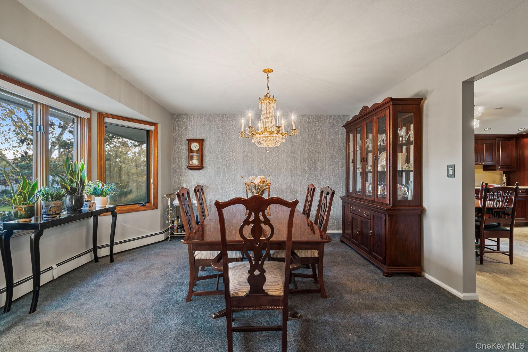 158 Old Courthouse Road Manhasset Hills, NY 11040 - Photo 11 of 47 a view of a dining room with furniture window and outside view