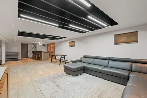 a living room with furniture and white walls