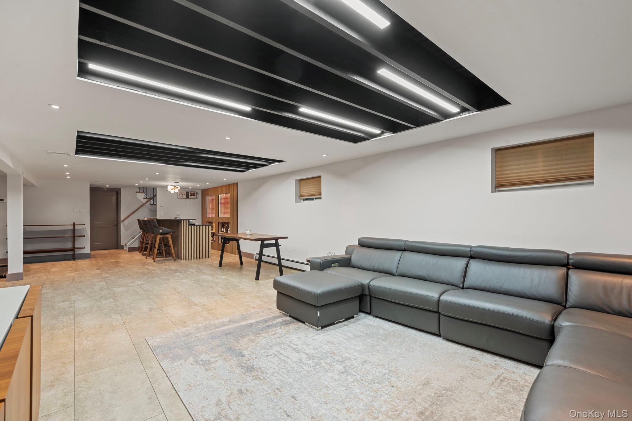 158 Old Courthouse Road Manhasset Hills, NY 11040 - Photo 31 of 47 a living room with furniture and white walls