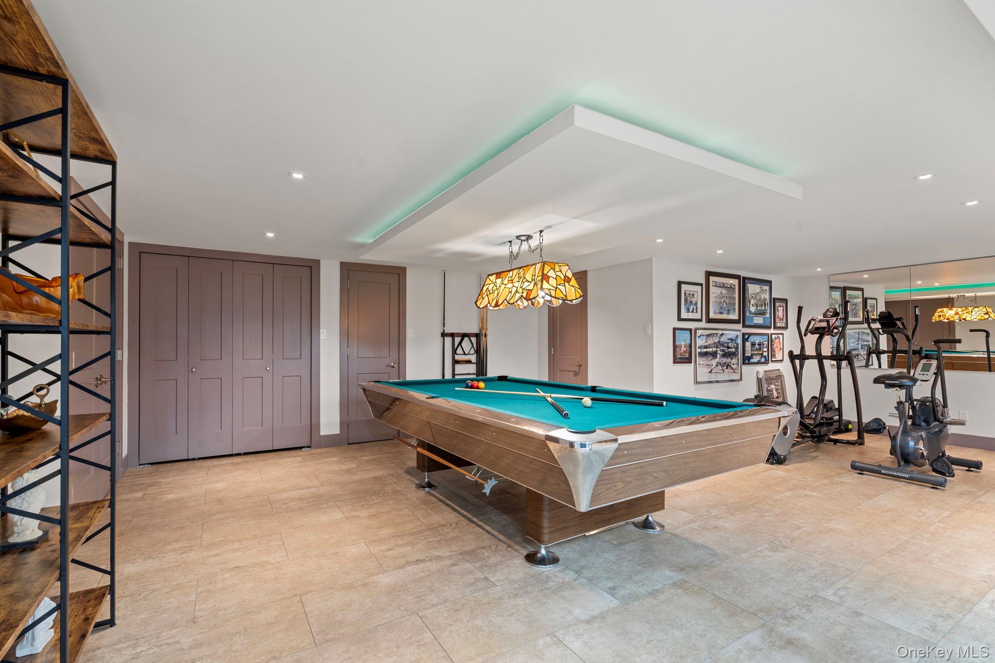 158 Old Courthouse Road Manhasset Hills, NY 11040 - Photo 34 of 47 a room with gym equipment and pool table