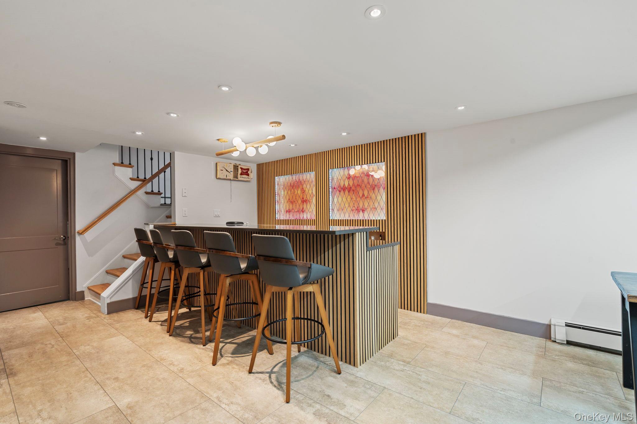 158 Old Courthouse Road Manhasset Hills, NY 11040 - Photo 35 of 47 a view of a livingroom with furniture and a flat screen tv