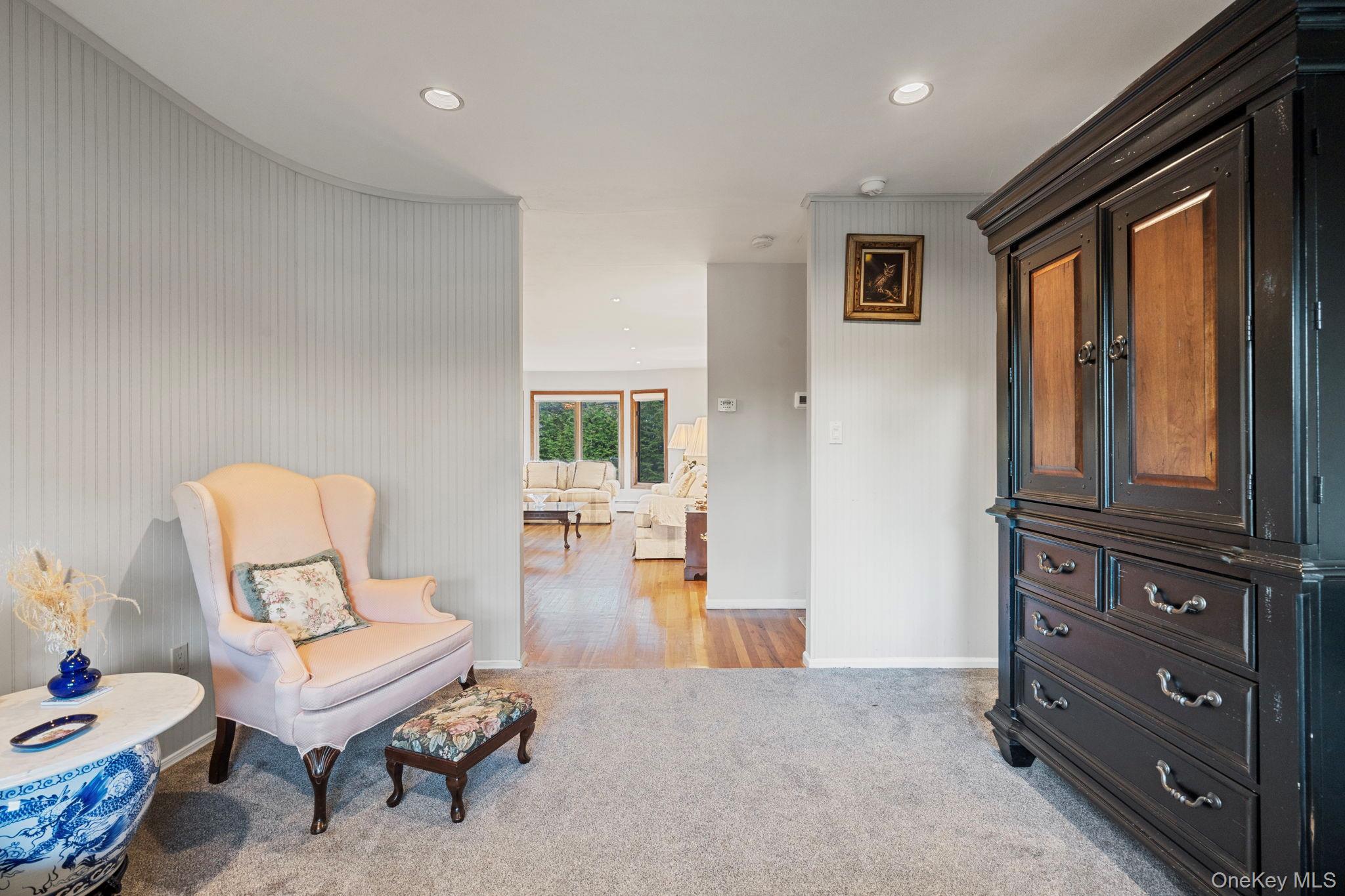 158 Old Courthouse Road Manhasset Hills, NY 11040 - Photo 10 of 47 a living room with furniture and a window
