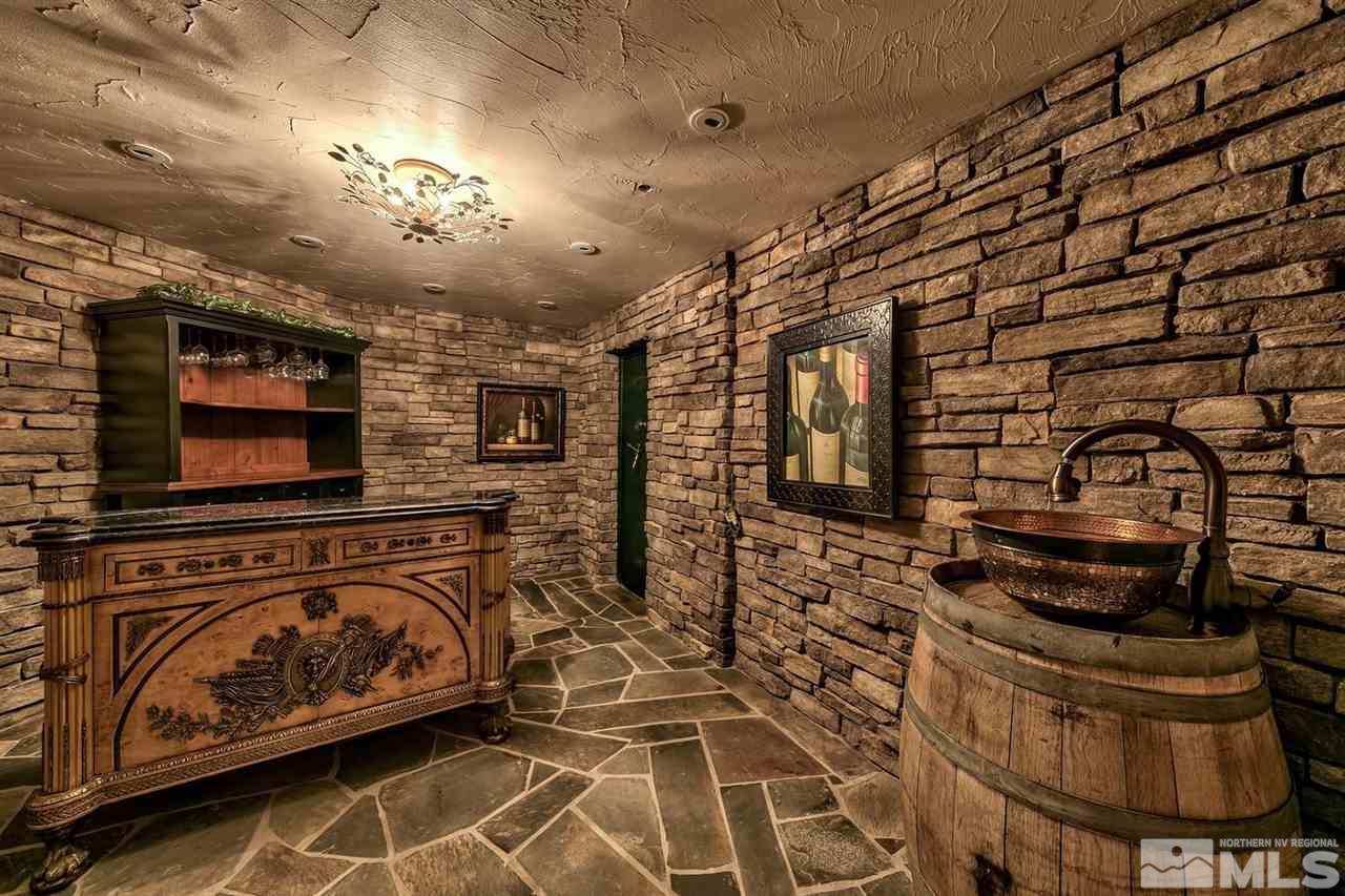 277 Fredricksburg Road Gardnerville, NV 89460 - Photo 13 of 27 a view of a fireplace with wooden floor
