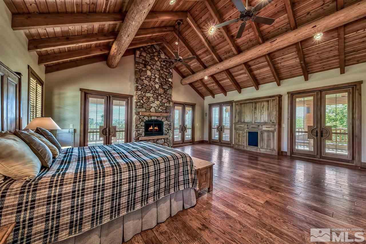 277 Fredricksburg Road Gardnerville, NV 89460 - Photo 15 of 27 a bed sitting in a spacious bedroom next to a larger window