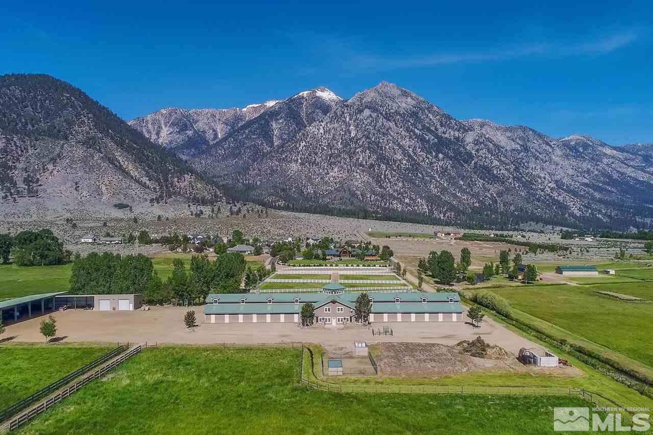 277 Fredricksburg Road Gardnerville, NV 89460 - Photo 22 of 27 a view of a swimming pool with lawn chairs and a big yard