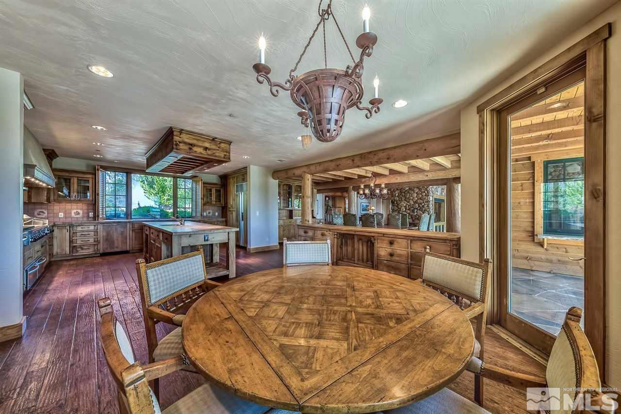 277 Fredricksburg Road Gardnerville, NV 89460 - Photo 9 of 27 a view of a dining room with furniture wooden floor and chandelier
