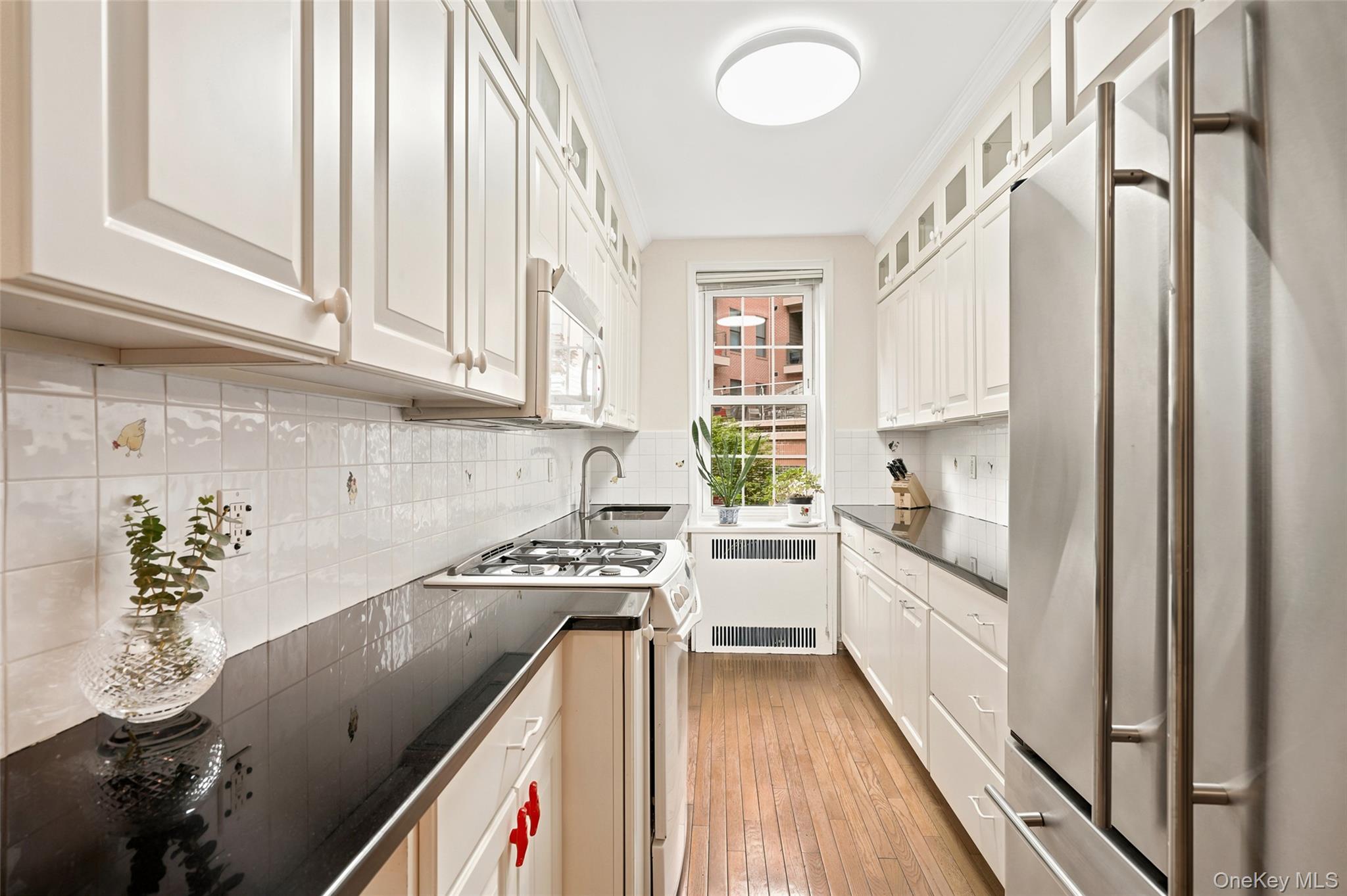 949 Palmer Road, Unit 1R Bronxville, NY 10708 - Photo 8 of 21 The kitchen is thoughtfully designed, offering abundant cabinetry, generous counter space and an efficient layout for everyday living.