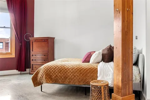 a bedroom with a bed and a closet