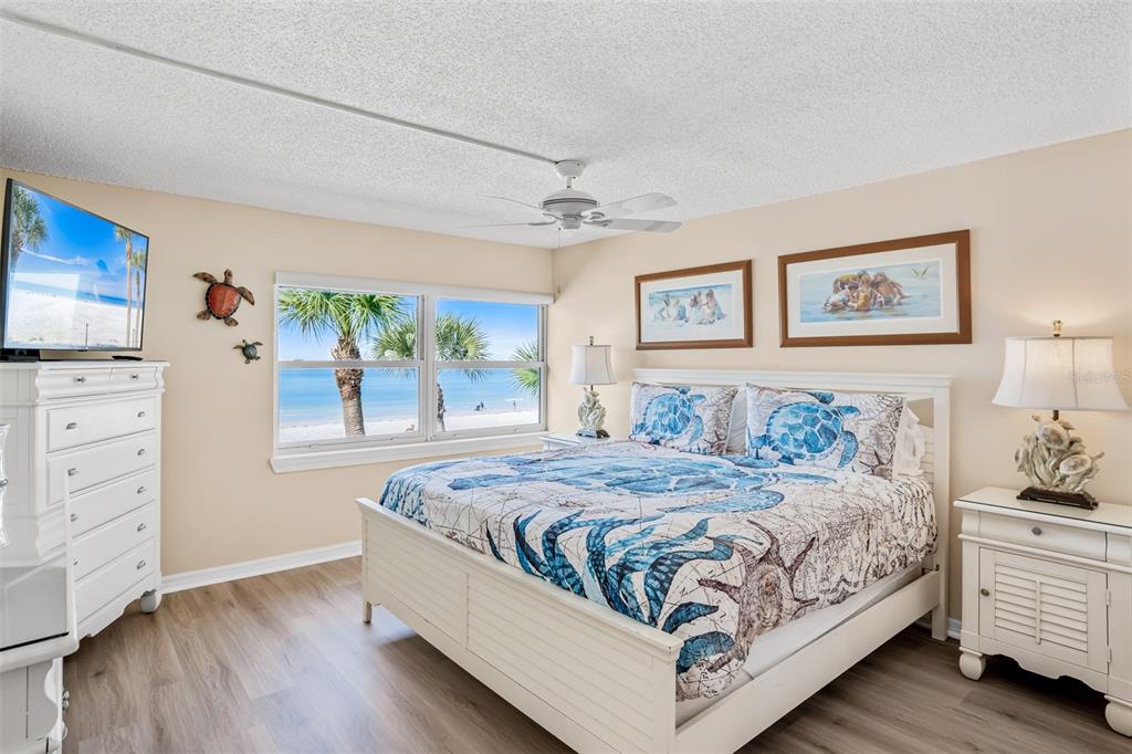 60 Gulf Boulevard, Unit 203 Indian Rocks Beach, FL 33785 - Photo 23 of 53 a bedroom with a bed and a dresser
