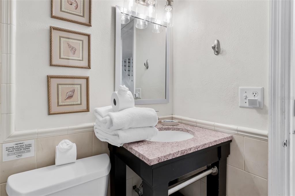 60 Gulf Boulevard, Unit 203 Indian Rocks Beach, FL 33785 - Photo 35 of 53 a bathroom with a sink and a mirror