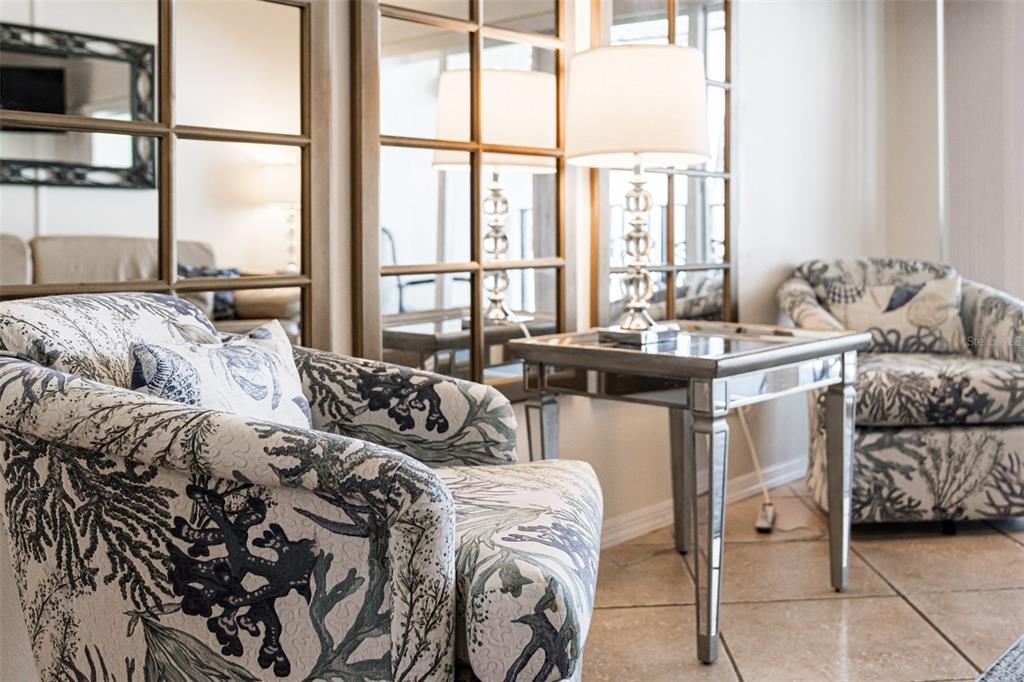 60 Gulf Boulevard, Unit 203 Indian Rocks Beach, FL 33785 - Photo 41 of 53 a living room with furniture and a floor to ceiling window