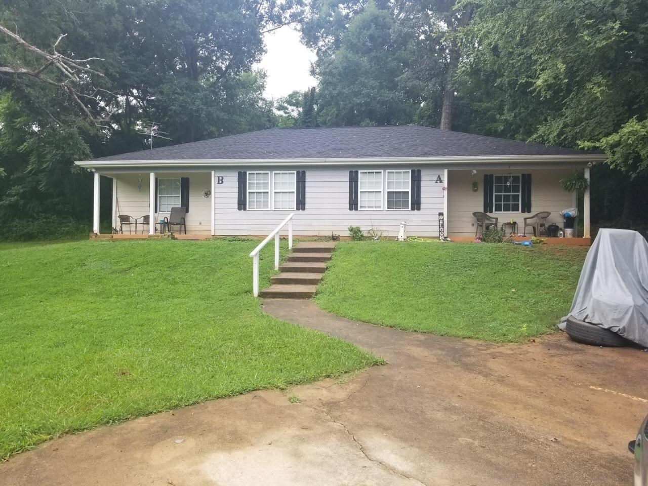 124 Old S River Road Jackson, GA 30233 - Photo 1 of 1 a front view of house with a garden and patio