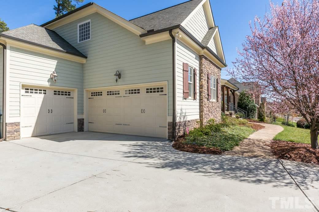 5342 Landguard Drive Raleigh, NC 27613 - Photo 2 of 25 a front view of a house with garden