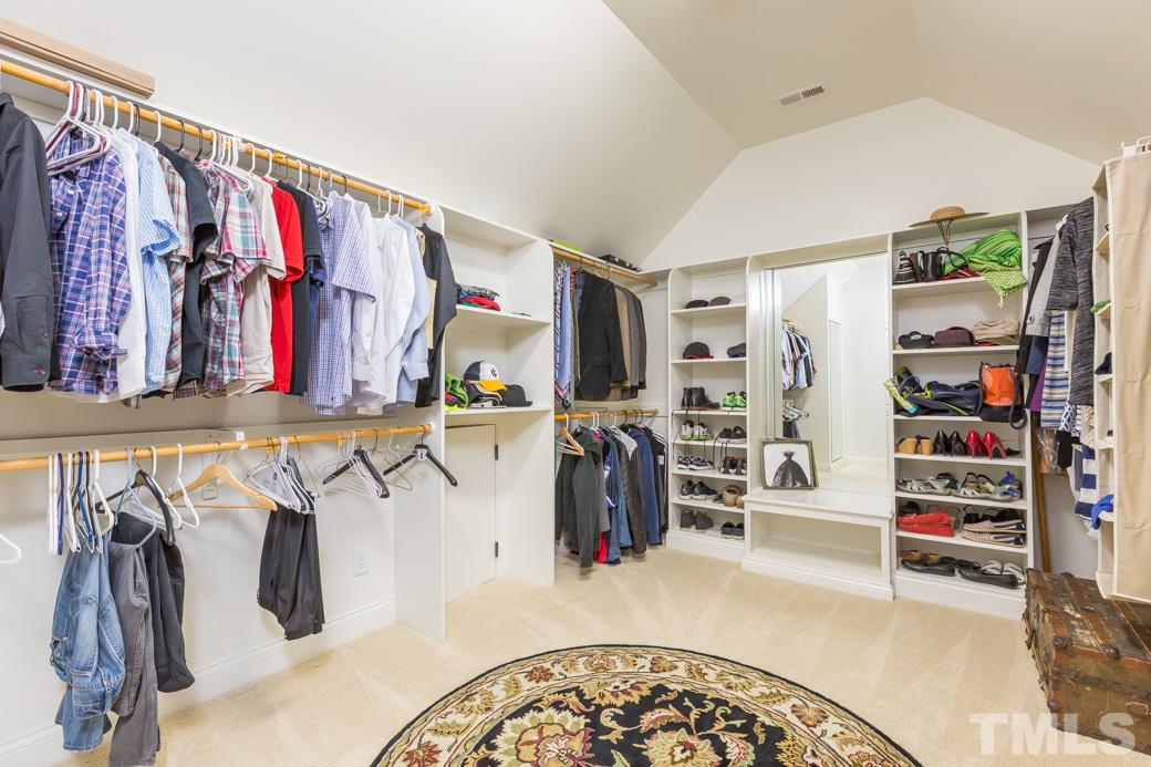 5342 Landguard Drive Raleigh, NC 27613 - Photo 17 of 25 a view of walk in closet with clothes and shoes