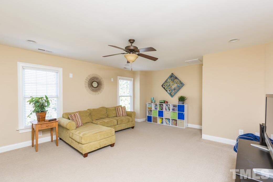 5342 Landguard Drive Raleigh, NC 27613 - Photo 18 of 25 a living room with furniture and a large window