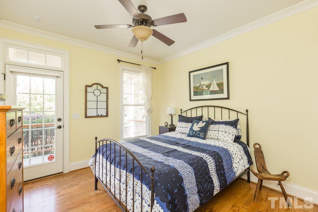 5342 Landguard Drive Raleigh, NC 27613 - Photo 20 of 25 a bedroom with a large bed and a window