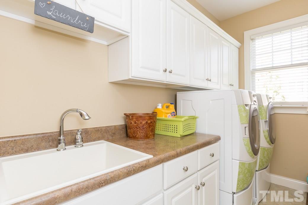 5342 Landguard Drive Raleigh, NC 27613 - Photo 23 of 25 a bathroom with a sink and a window