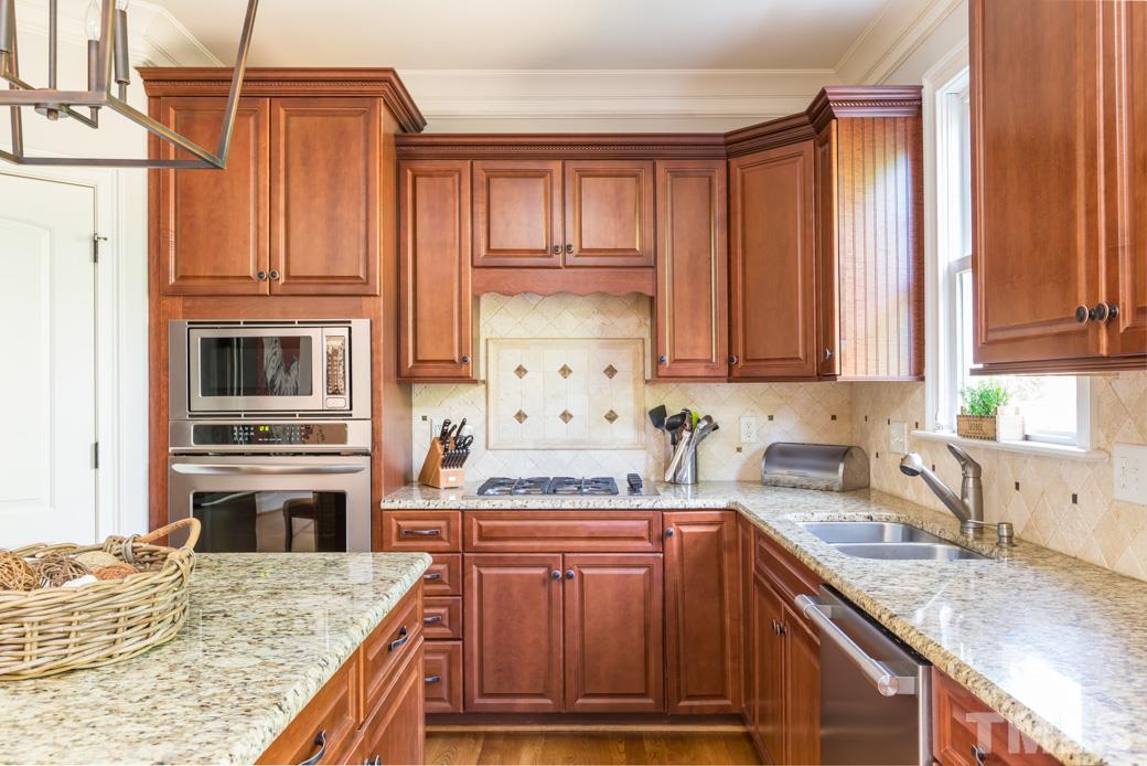 5342 Landguard Drive Raleigh, NC 27613 - Photo 9 of 25 a kitchen with cabinets appliances and a counter space