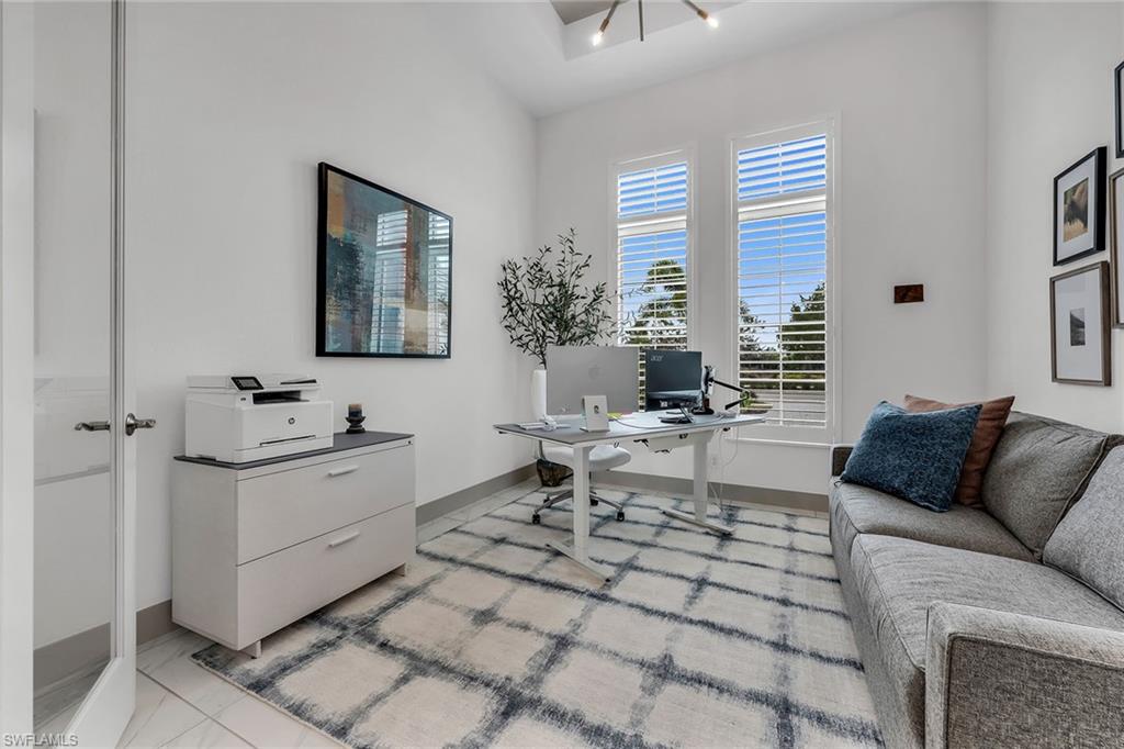 6184 Antigua Way Naples, FL 34113 - Photo 15 of 49 a living room with furniture and a window