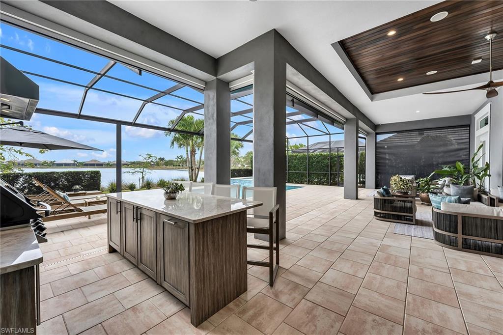 6184 Antigua Way Naples, FL 34113 - Photo 18 of 49 a kitchen with stainless steel appliances granite countertop a sink and stove