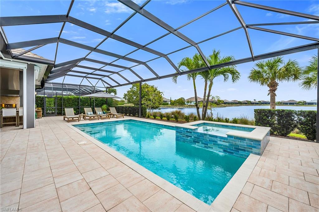 6184 Antigua Way Naples, FL 34113 - Photo 19 of 49 a view of swimming pool with a patio
