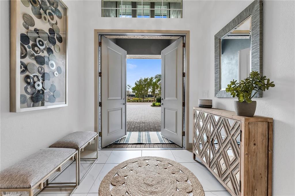 6184 Antigua Way Naples, FL 34113 - Photo 2 of 49 a view of a hallway with a flower pot