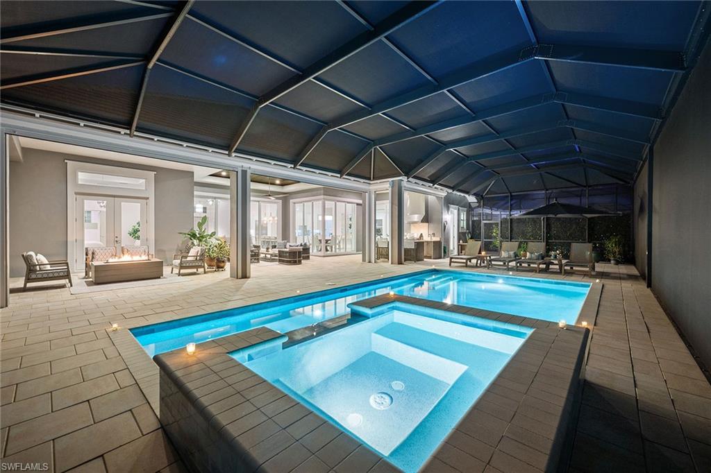 6184 Antigua Way Naples, FL 34113 - Photo 27 of 49 a view of swimming pool with seating area