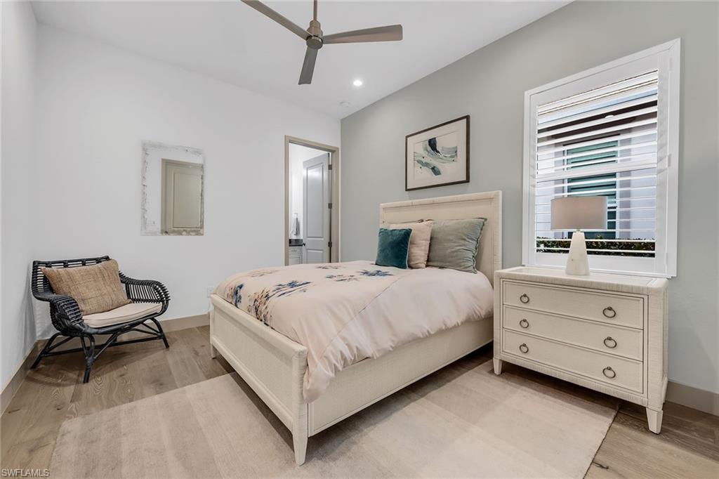 6184 Antigua Way Naples, FL 34113 - Photo 9 of 49 a bedroom with a bed and furniture