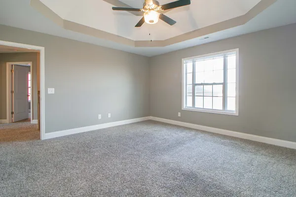 a bathroom with a toilet and a bathtub