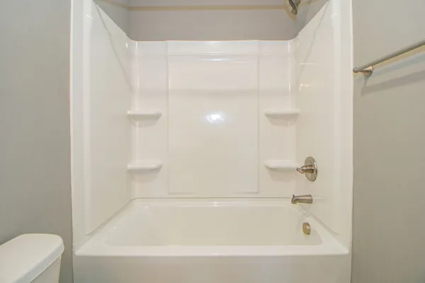 a view of an empty room with a fan