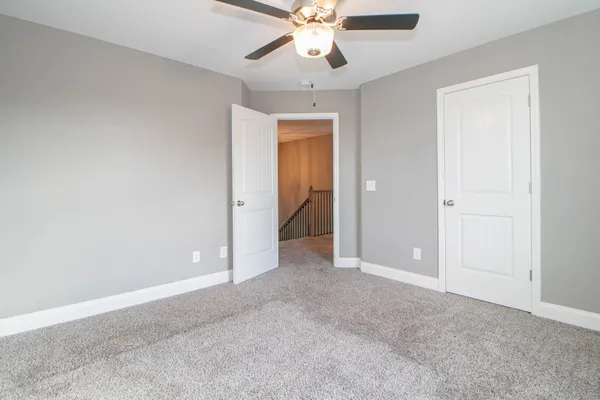 a view of a balcony with wooden floor