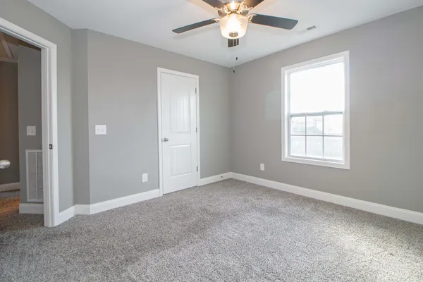 a view of a balcony with wooden floor