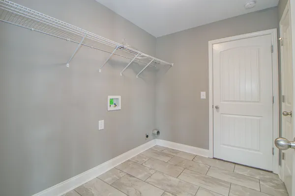 a view of a livingroom with a ceiling fan and window