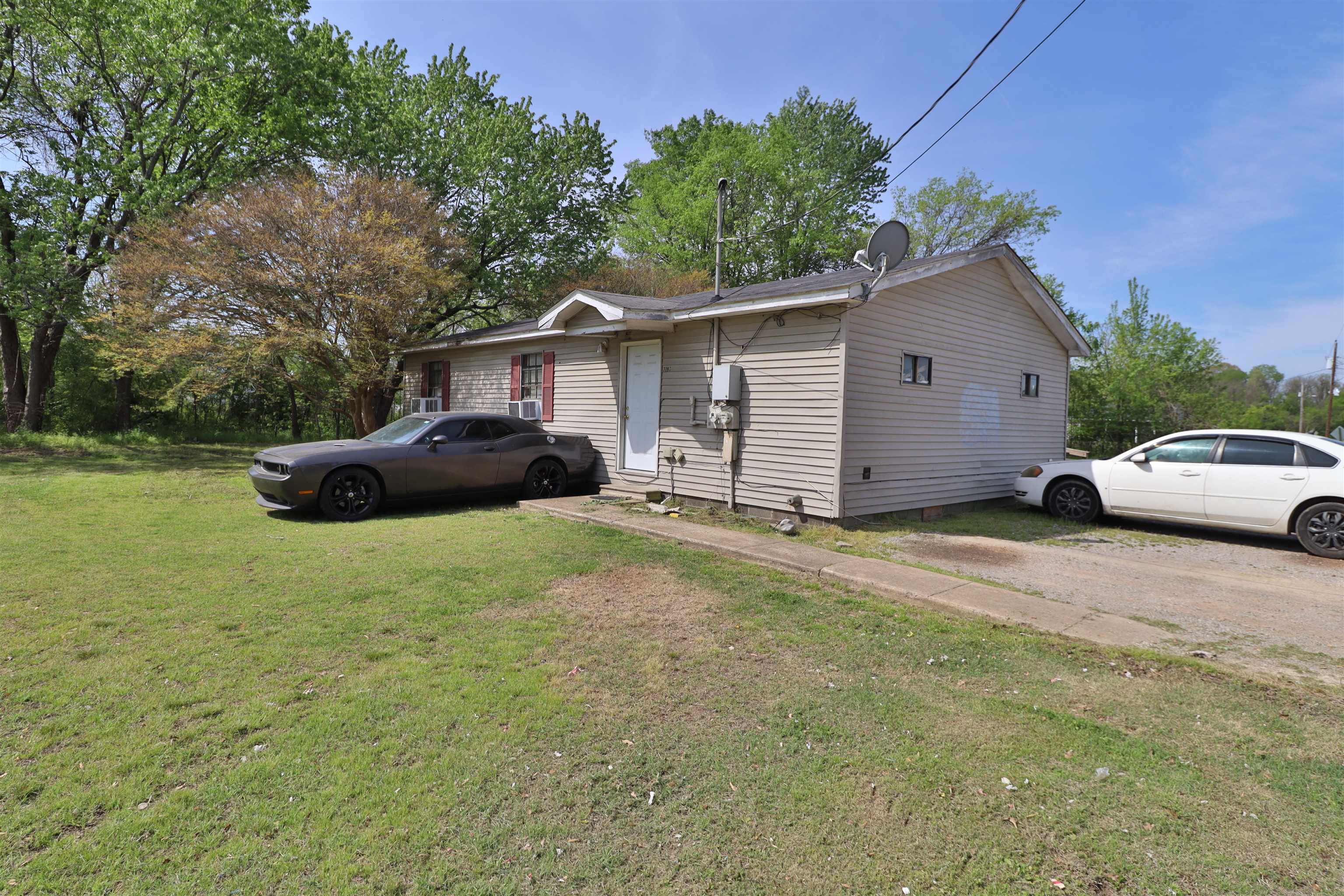 319 Wayne Avenue Ripley, TN 38063 - Photo 4 of 10 a front view of a house with garden