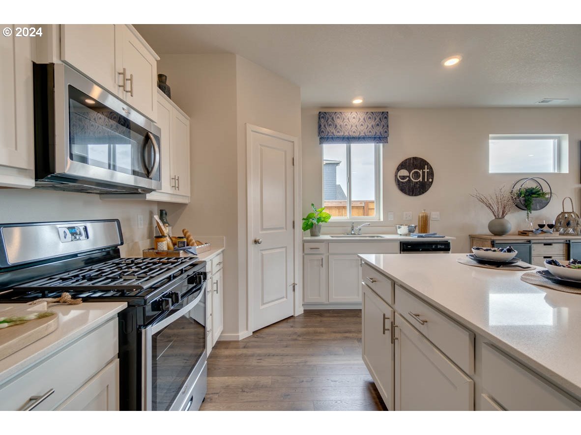 2961 V Street Springfield, OR 97477 - Photo 12 of 24 a kitchen with cabinets and appliances
