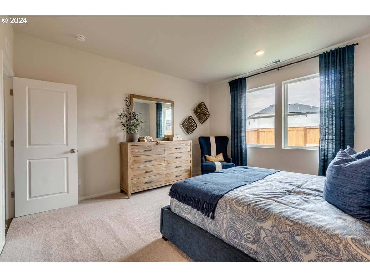 2961 V Street Springfield, OR 97477 - Photo 18 of 24 a bedroom with a large bed and a window