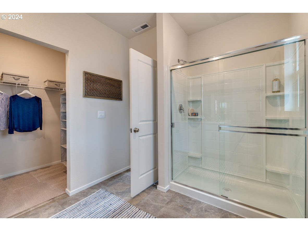 2961 V Street Springfield, OR 97477 - Photo 20 of 24 a bathroom with a shower and a glass door