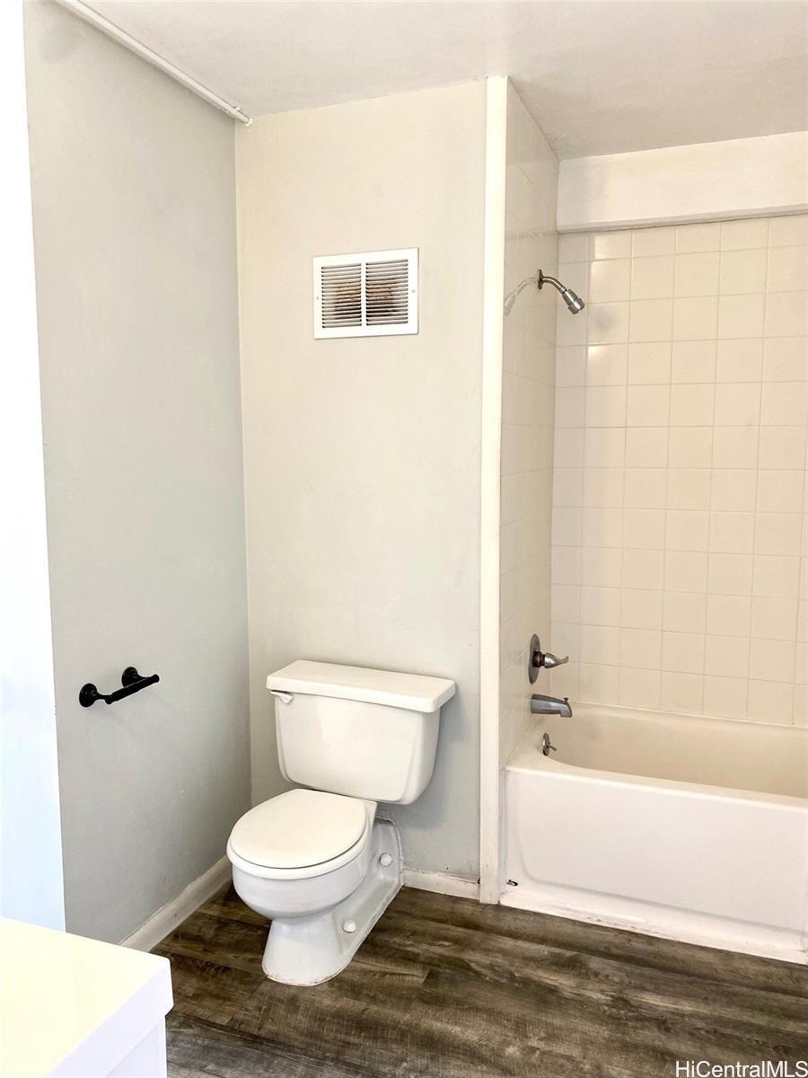 99-70 Kauhale Street, Unit 606 Aiea, HI 96701 - Photo 6 of 8 a bathroom with a toilet and a shower